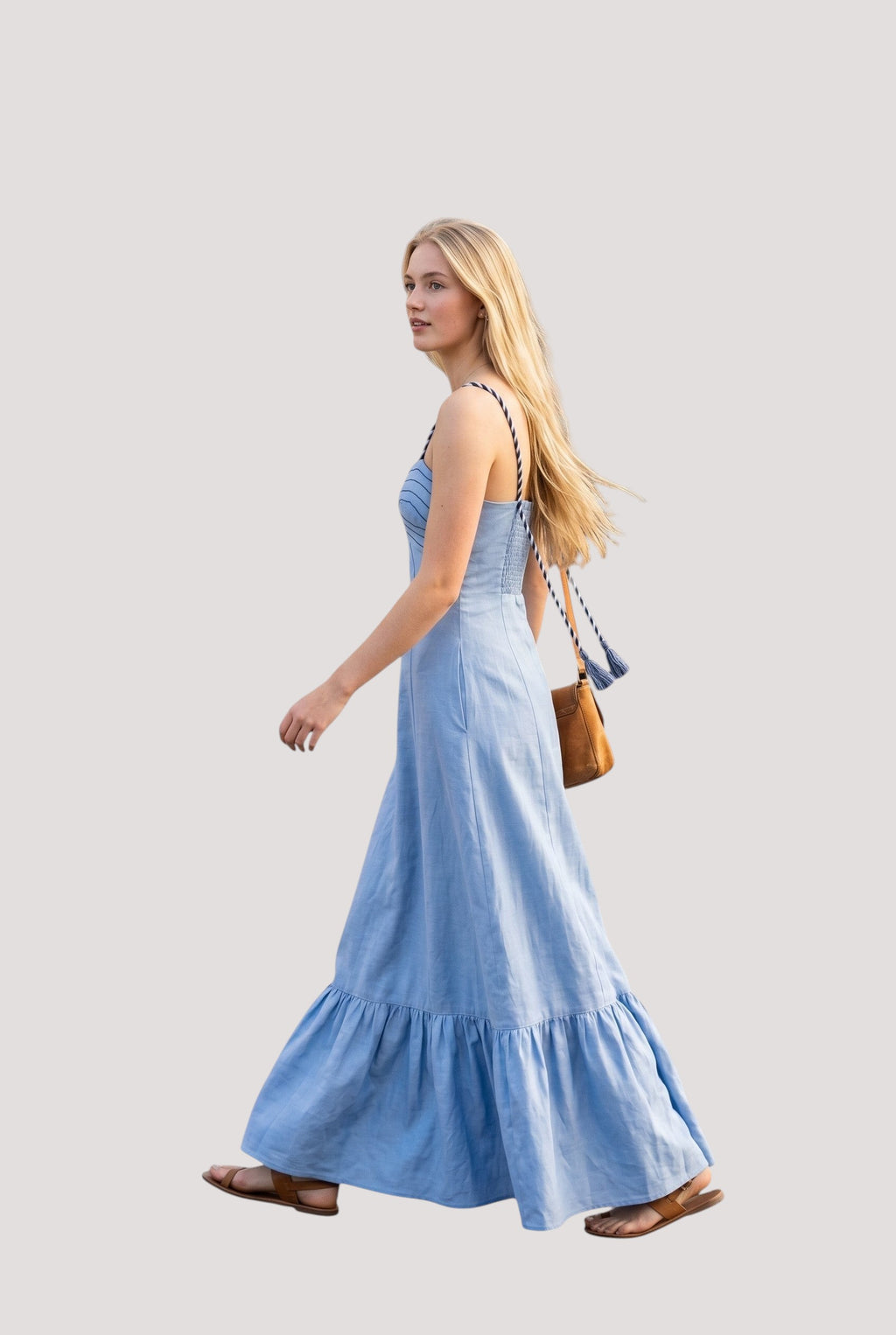 Minimistcloset sky blue linen-blend maxi dress with corset bodice, braided straps, and tiered hem on a walking model.