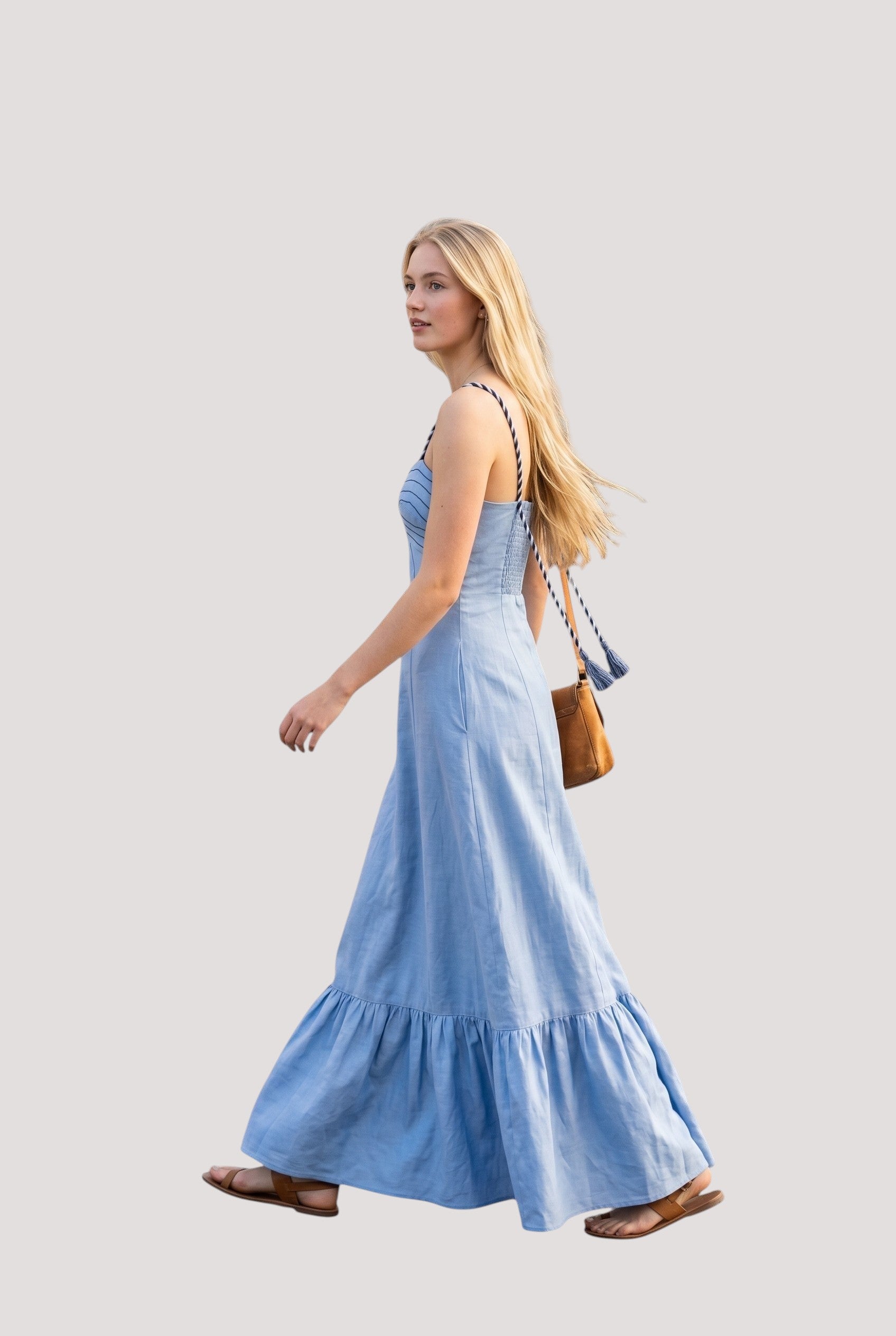 Minimistcloset sky blue linen-blend maxi dress with corset bodice, braided straps, and tiered hem on a walking model.